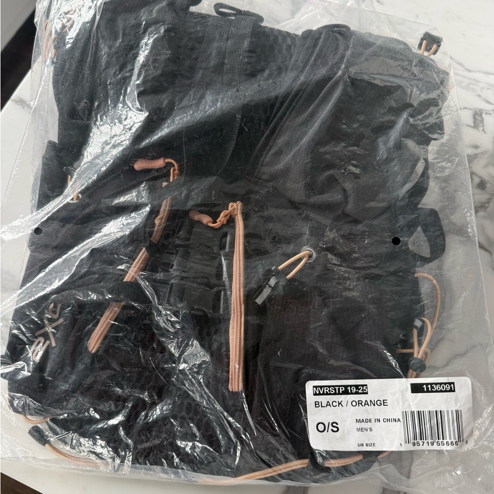Unisex Black and Orange Lightweight Backpack great for runners or hikers.